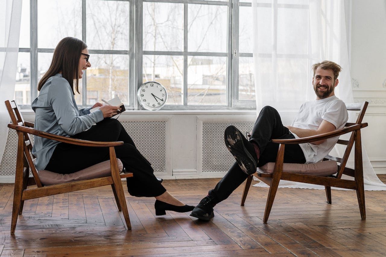 a counselor/coach visiting with a client