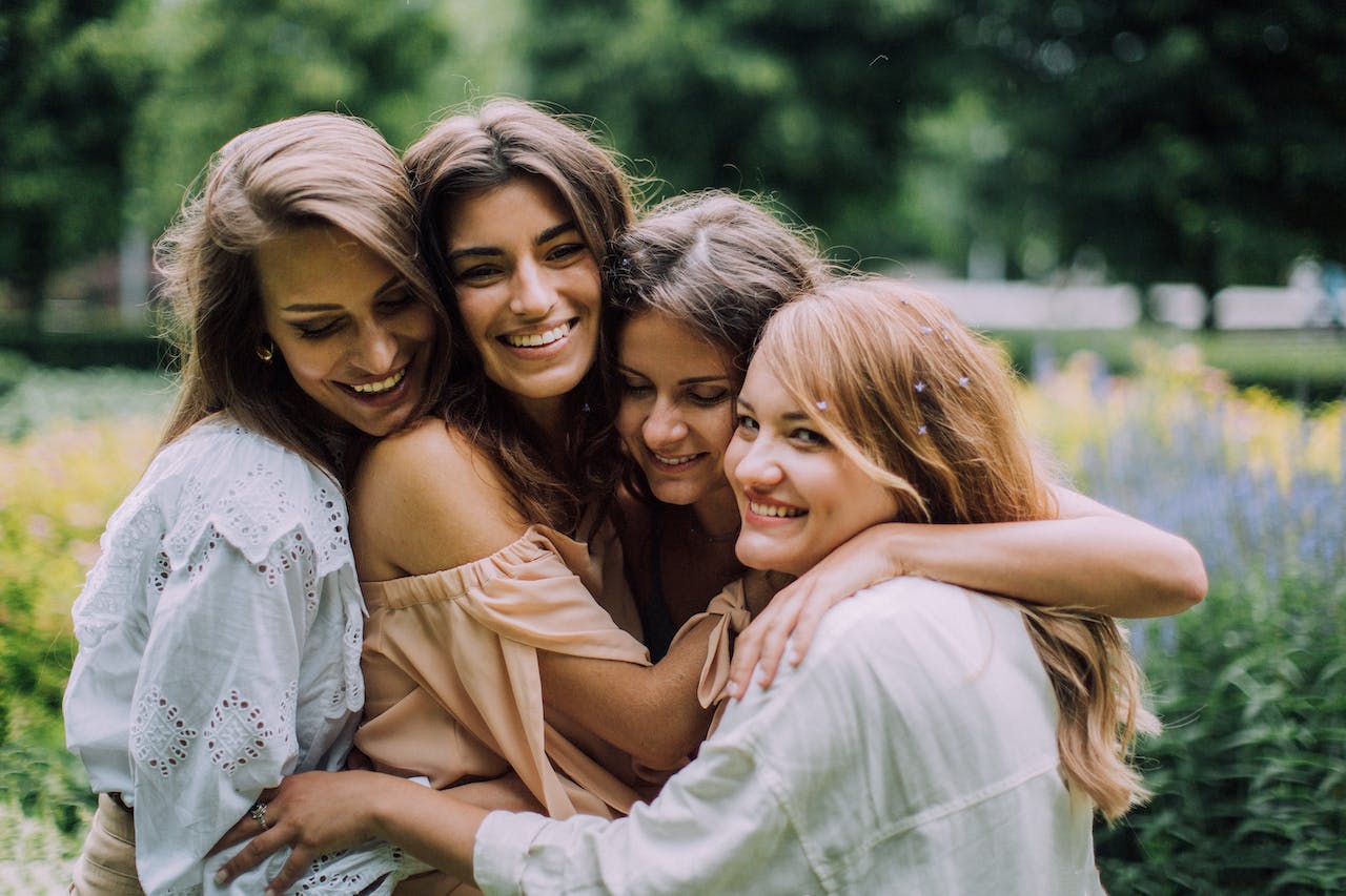 adult sisters hugging